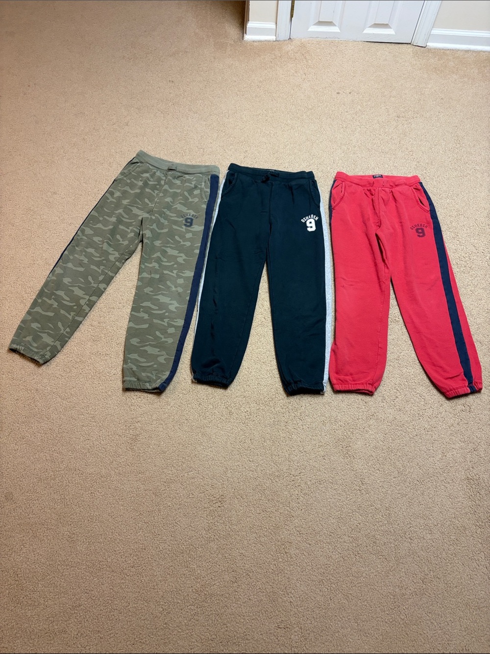 OshKosh B'gosh 3-Pack Jogger Sweatpants in Olive Camo, Navy, and Red
